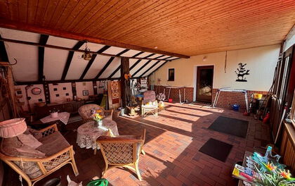 Einfamilienhaus mit zusätzlichem Nebengebäude und großzügigem Garten in zentraler Lage von Grasberg